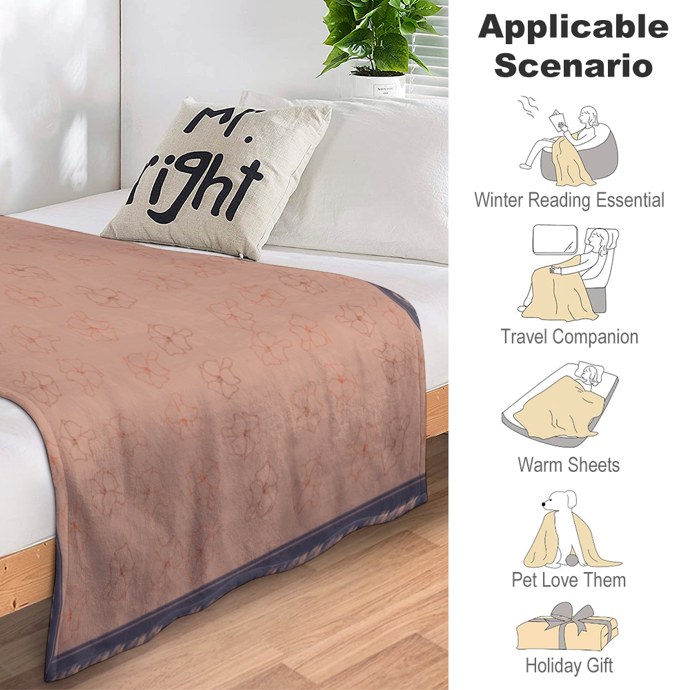 Sunkissed terracotta colored flannel blanket with Puakenikeni floral design