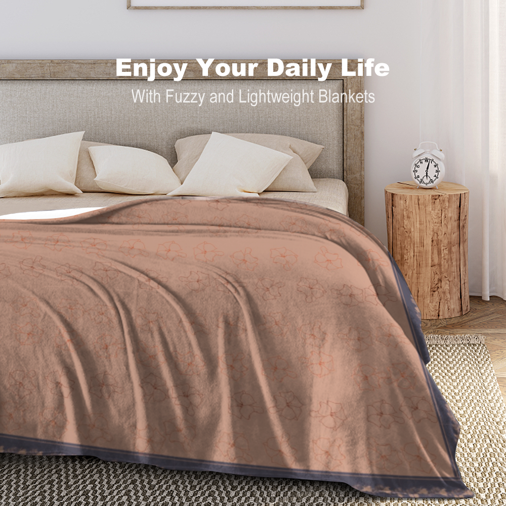 Sunkissed terracotta colored flannel blanket with Puakenikeni floral design